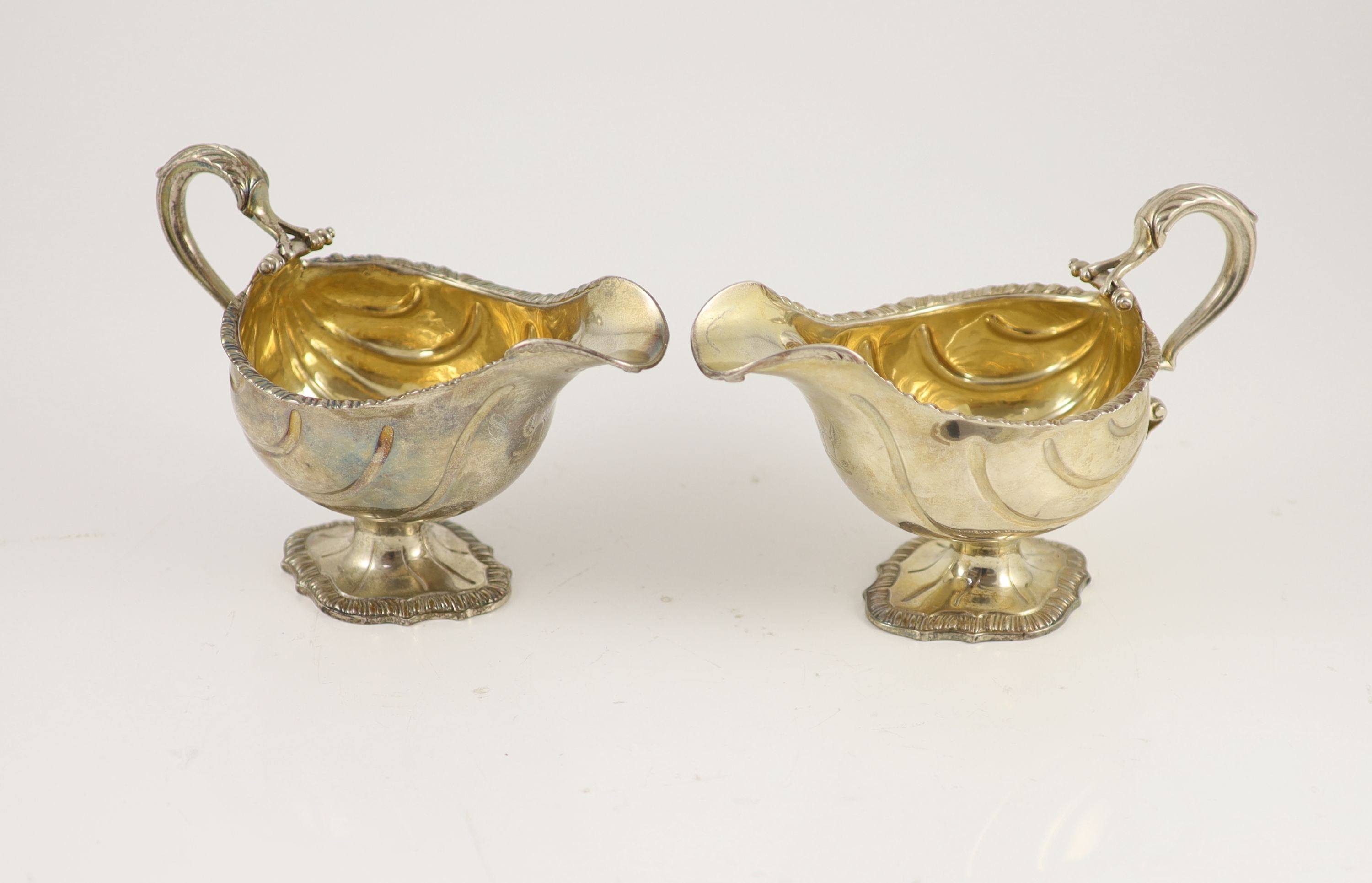 A pair of early George III silver oval pedestal sauce boats by Whyte & Holmes?
